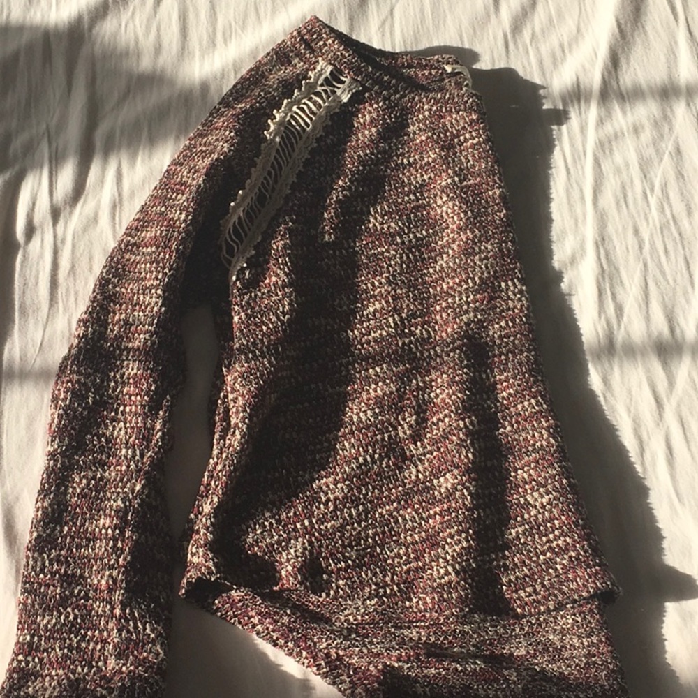 Red, black, and white sweater